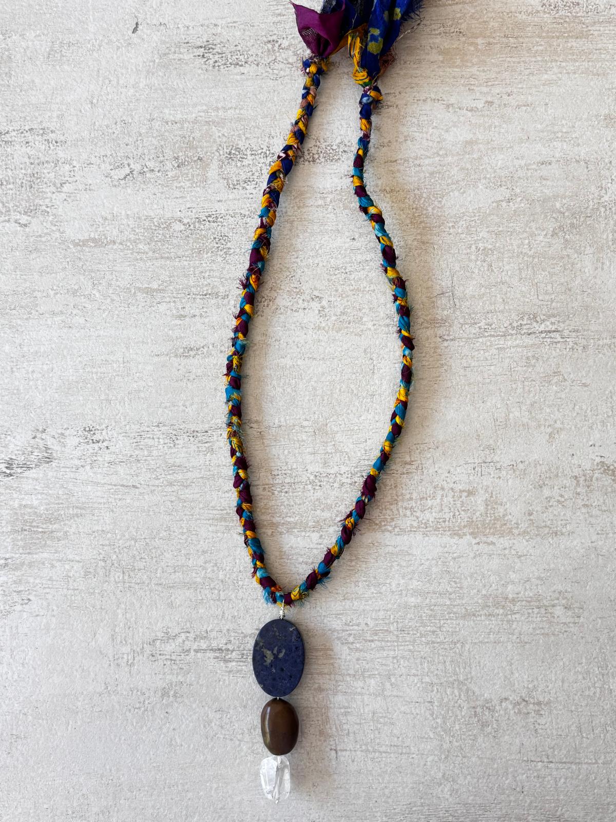 Lapis lazuli, brown turquoise and crackled quartz pendant hanging from a braided vintage sari silk cord in teal, mustard and plum