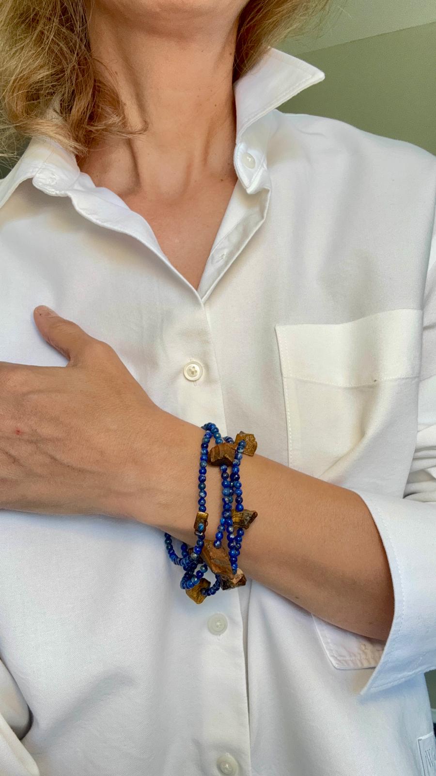 The same necklace wound four times around the wrist as a wrap bracelet