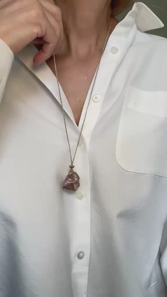 Video of the pendant worn, showing the braid and the pink stone