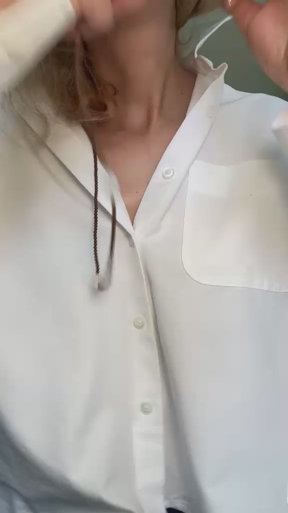Video of the copper hematite and raw clear quartz necklace moving in the light
