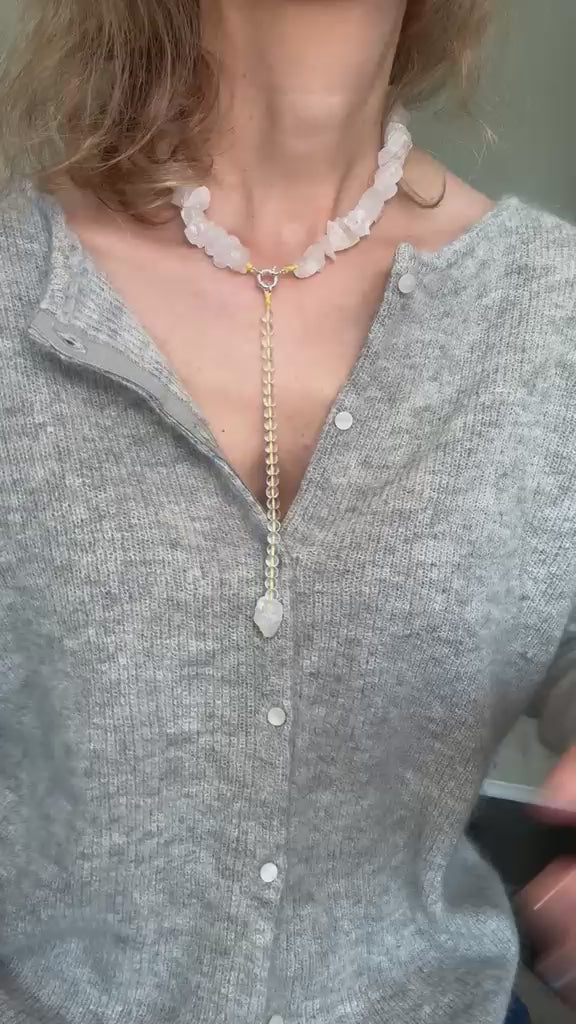 Video of the raw clear quartz necklace, showing the drop attaching and the light through the stone