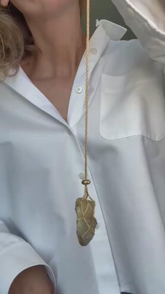 Video of the raw grey agate pendant turning on its braided silk cord